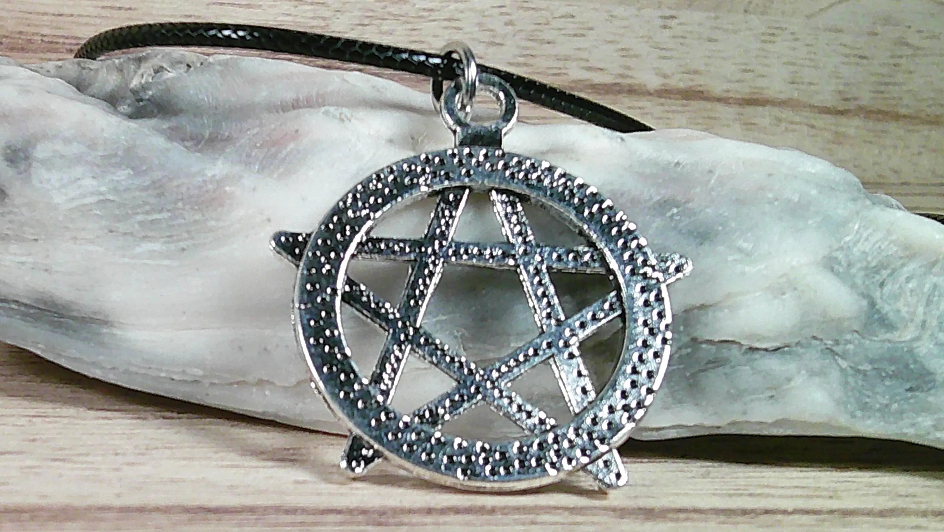 Star Necklace. Punk and Gothic style silvery star pendant on faux leather cord.