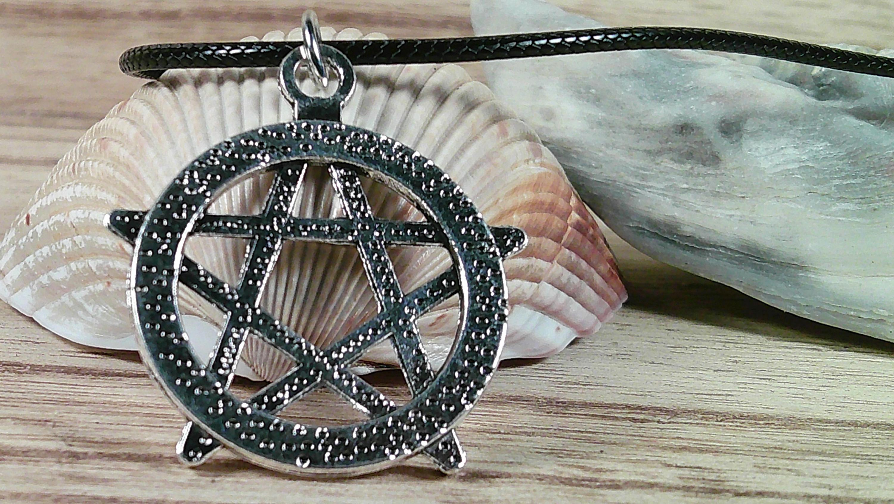 Star Necklace. Punk and Gothic style silvery star pendant on faux leather cord.